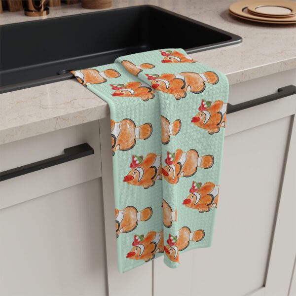 Clown fish watercolor tea towel on pale mint green background by Paul Myrick