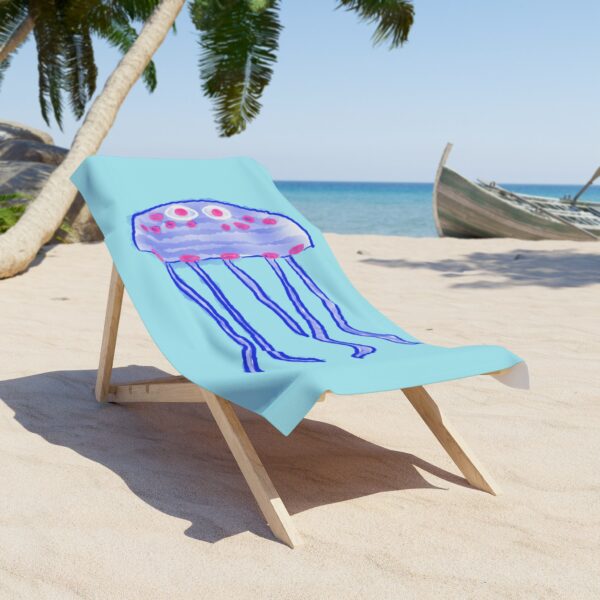 Coastal beach towel featuring whimsical jellyfish watercolor art