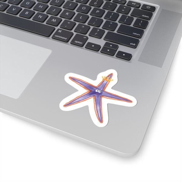 Whimsical purple starfish with golden crown on kiss-cut sticker backing