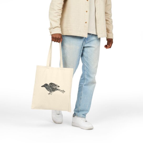 Tote bag featuring a raven watercolor artwork by Paul Myrick