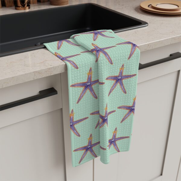 Seafoam green tea towel featuring whimsical starfish watercolor artwork