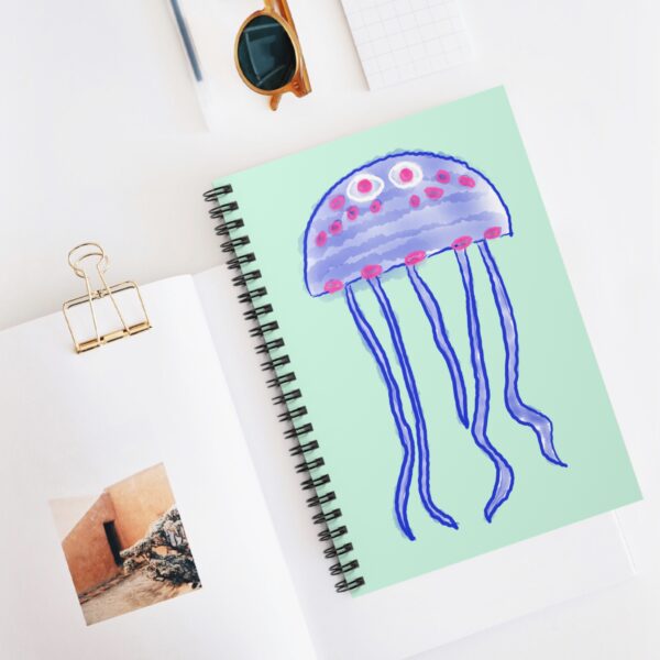 Jellyfish watercolor artwork on a seafoam green spiral notebook by Paul Myrick